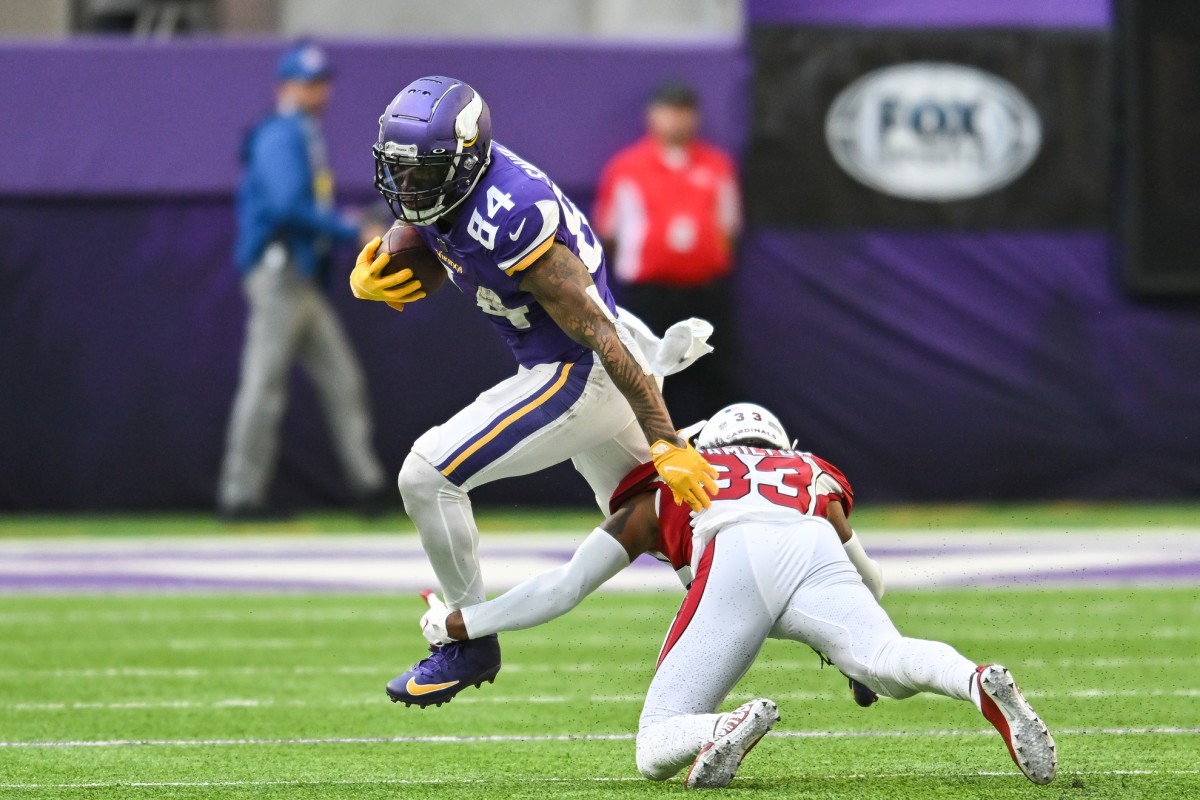 Oct 30, 2022; Minnesota Vikings tight end Irv Smith Jr. (84) avoids the tackle of Arizona Cardinals cornerback Antonio Hamilton (33). Mandatory Credit: Jeffrey Becker-USA TODAY Sports